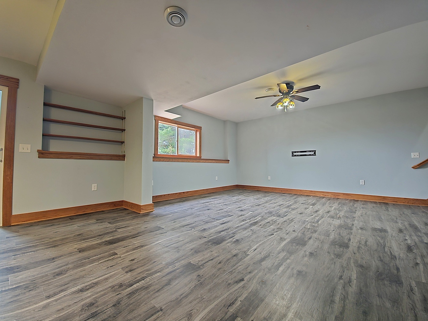 809 McCoy Road Amboy, IL 61310 - Photo 36 of 58 a view of an empty room with a window and wooden floor