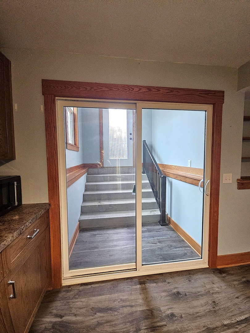 809 McCoy Road Amboy, IL 61310 - Photo 37 of 58 a view of entryway and hall with wooden floor