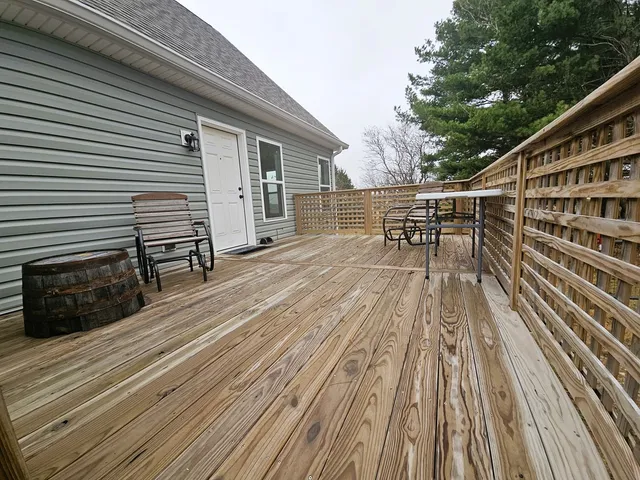 a house that has a tree in front of it