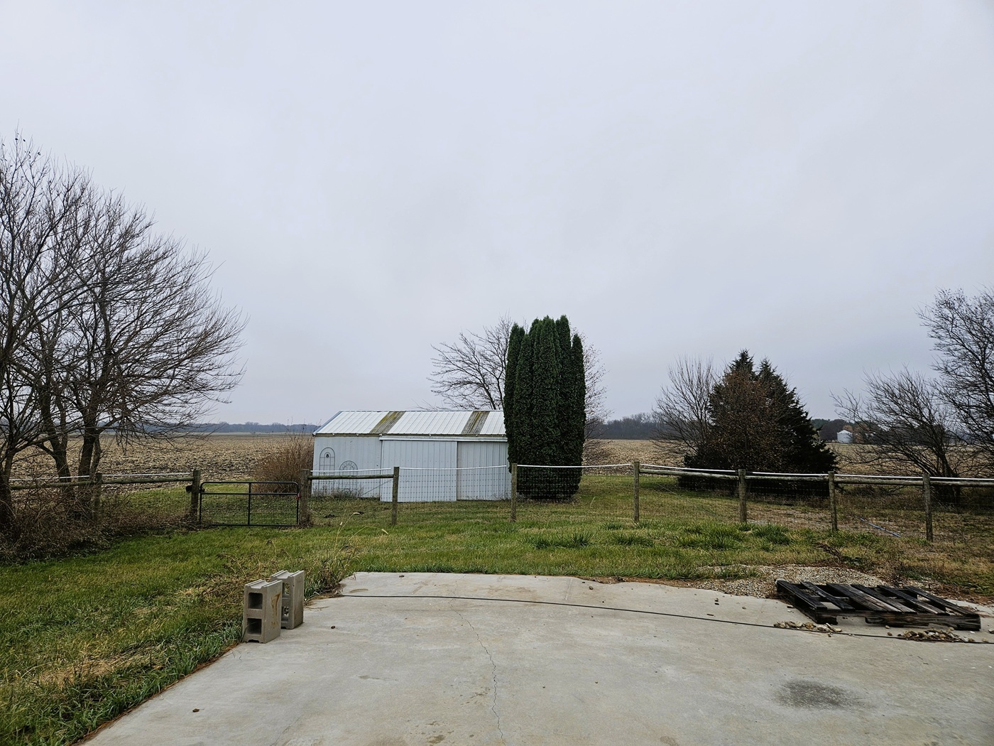 809 McCoy Road Amboy, IL 61310 - Photo 50 of 58 a front view of a house with a yard and a garage