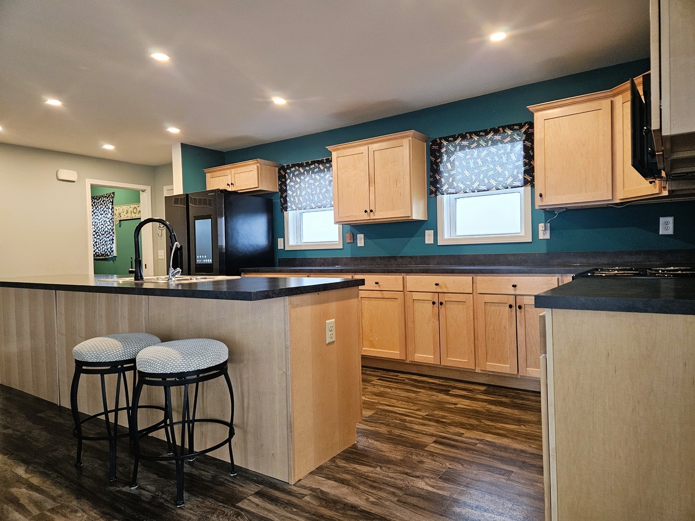 809 McCoy Road Amboy, IL 61310 - Photo 5 of 58 a kitchen with stainless steel appliances granite countertop a sink and a refrigerator