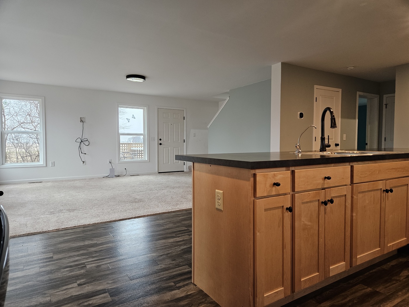 809 McCoy Road Amboy, IL 61310 - Photo 6 of 58 a view of a kitchen with window and wooden floor