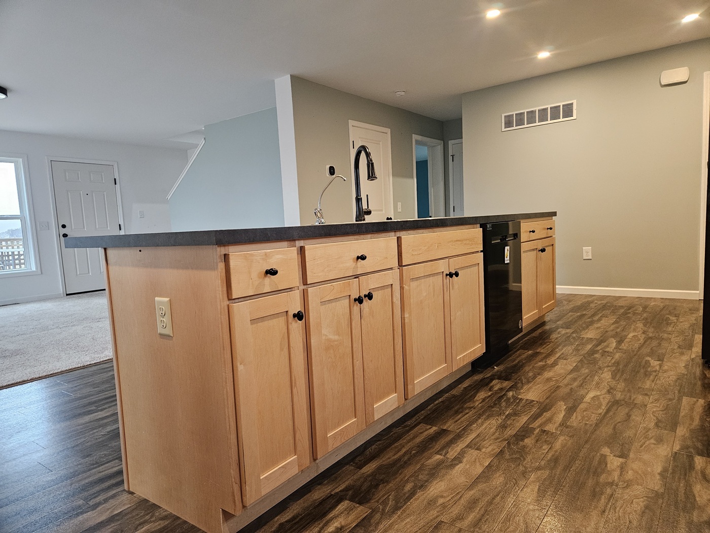 809 McCoy Road Amboy, IL 61310 - Photo 7 of 58 a view of a refrigerator in kitchen and wooden floor