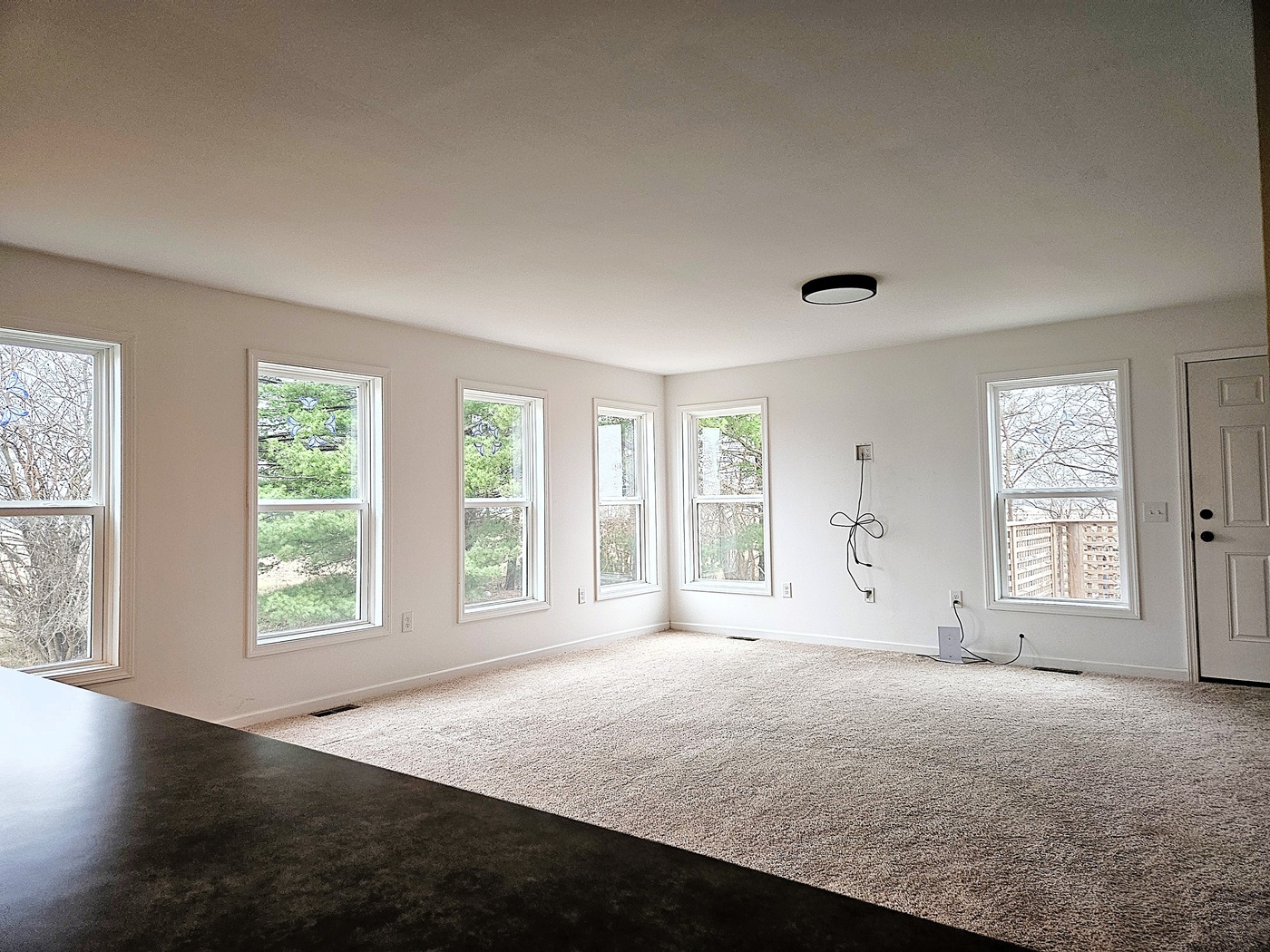 809 McCoy Road Amboy, IL 61310 - Photo 10 of 58 a view of a livingroom with a window and wooden floor