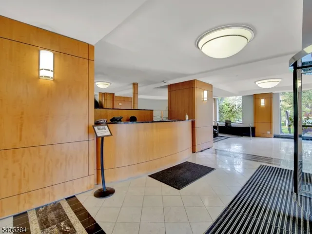 a view of kitchen with furniture and a refrigerator