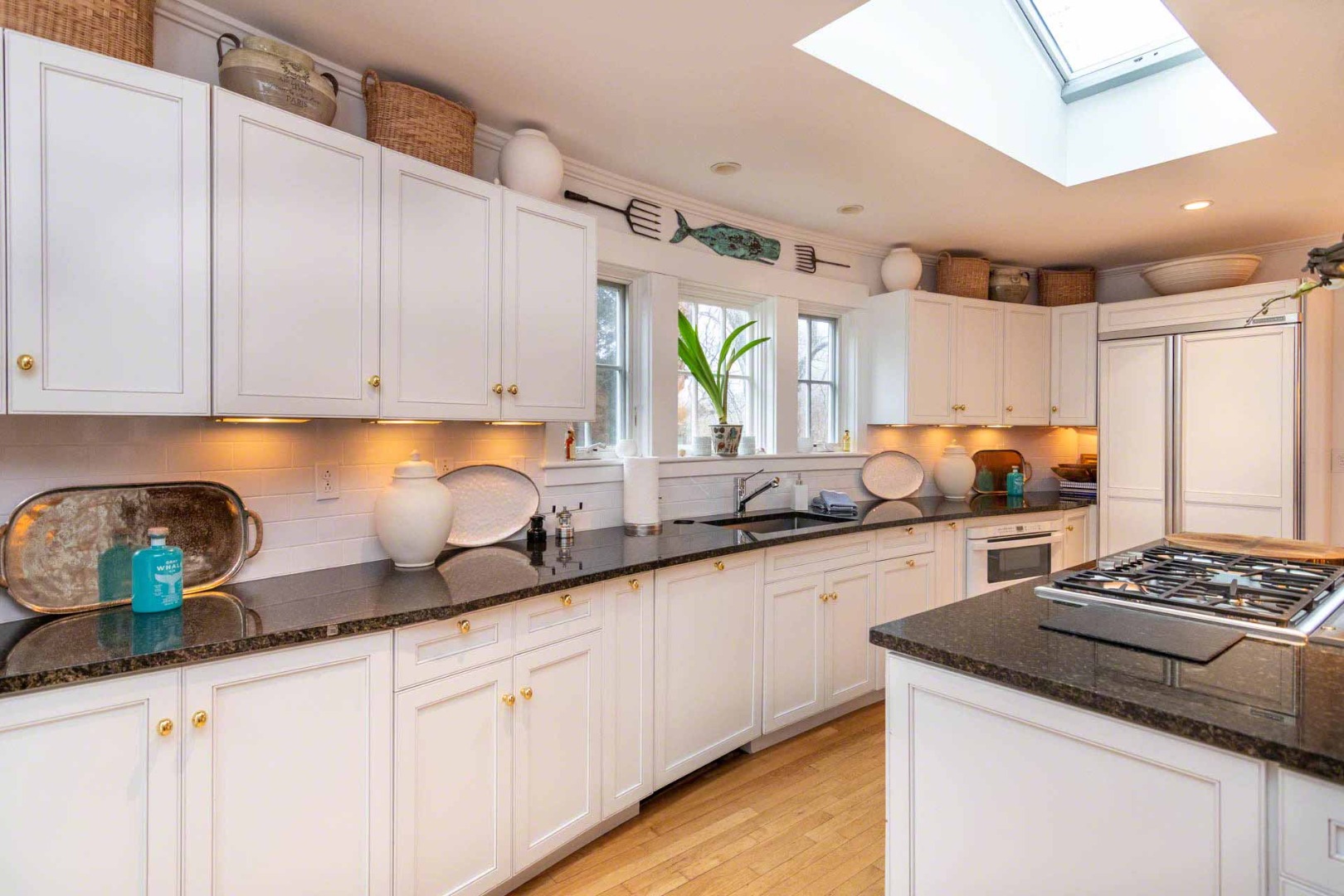 22 Edgartown Bay Road Edgartown, MA 02539 - Photo 17 of 55 a kitchen with granite countertop a sink a stove and cabinets