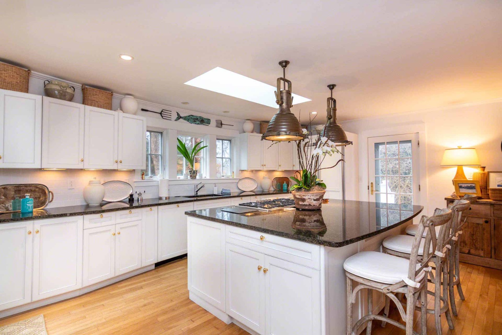 22 Edgartown Bay Road Edgartown, MA 02539 - Photo 19 of 55 a kitchen with stainless steel appliances granite countertop a sink a stove and cabinets