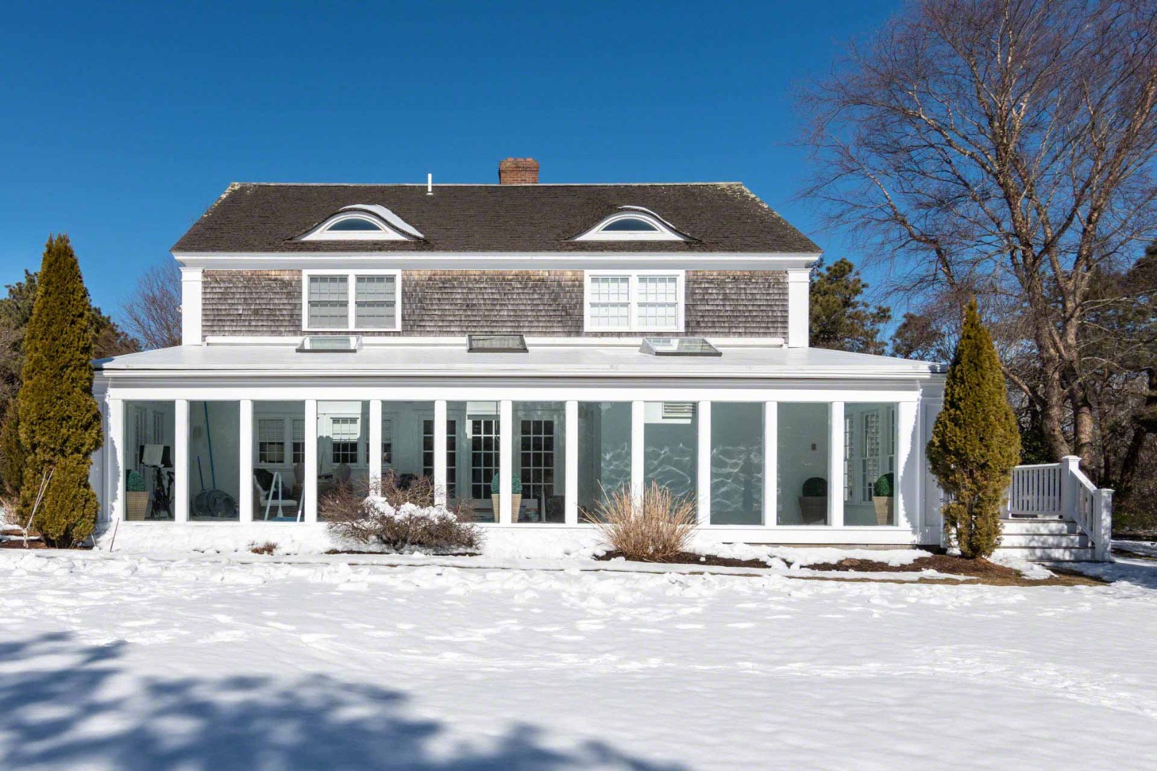 22 Edgartown Bay Road Edgartown, MA 02539 - Photo 3 of 55 front view of a brick house with a large window