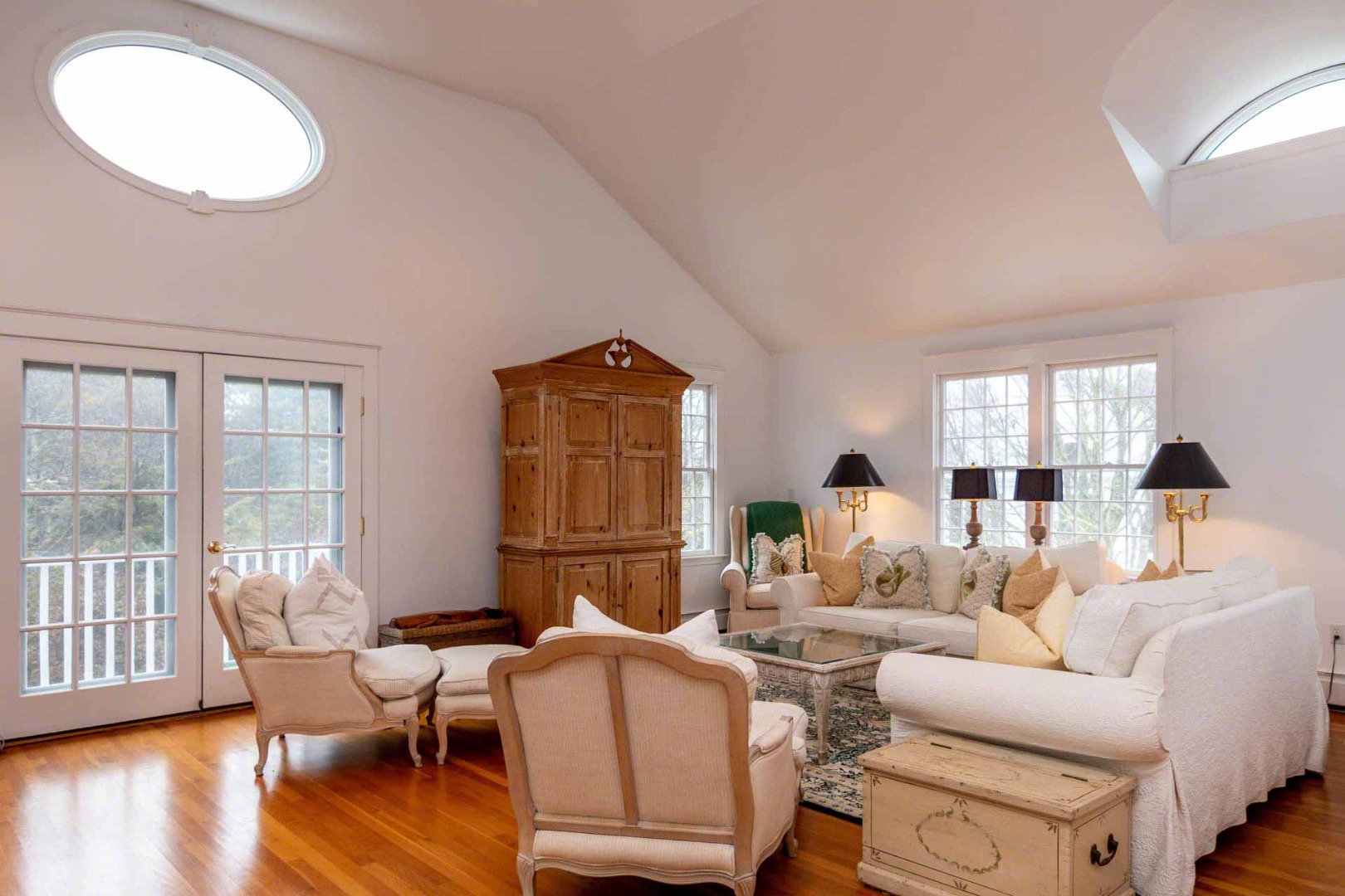 22 Edgartown Bay Road Edgartown, MA 02539 - Photo 50 of 55 a living room with furniture a wooden floor and a large window