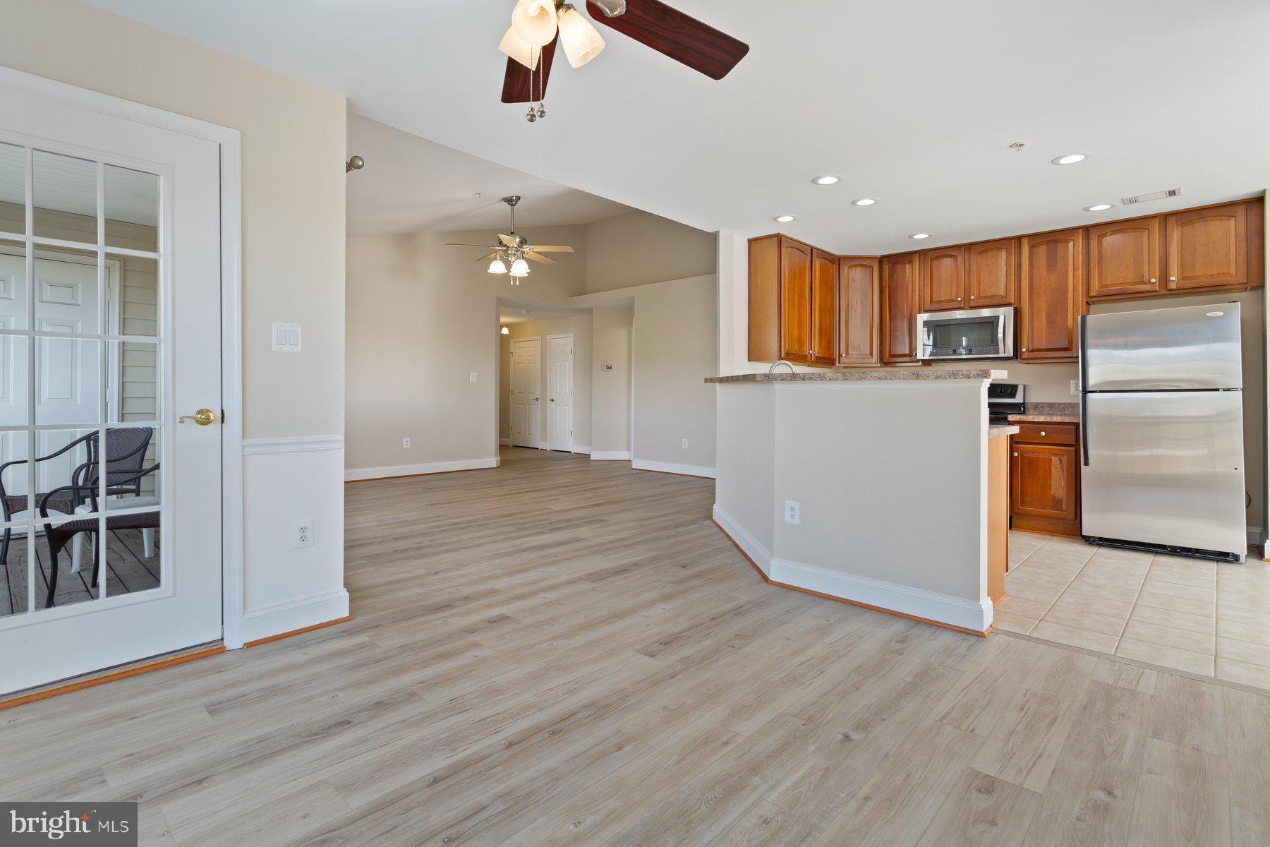 2500 Hemingway Drive, Unit 33D Frederick, MD 21702 - Photo 12 of 29 an empty room with wooden floor and windows