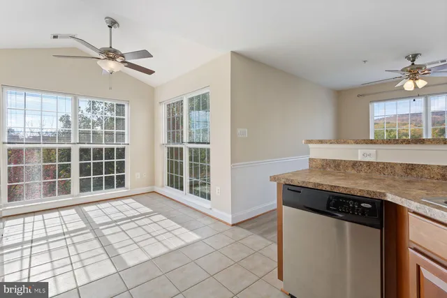a view of a kitchen with a sink and a window
