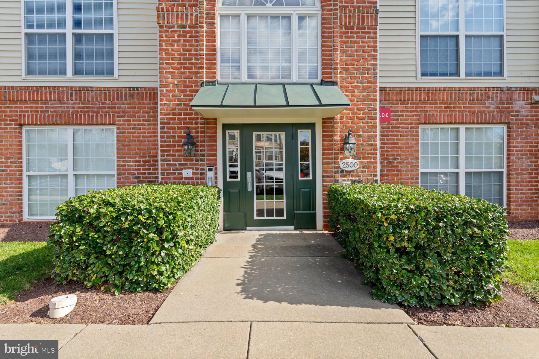 2500 Hemingway Drive, Unit 33D Frederick, MD 21702 - Photo 2 of 29 front view of a brick house with a large window