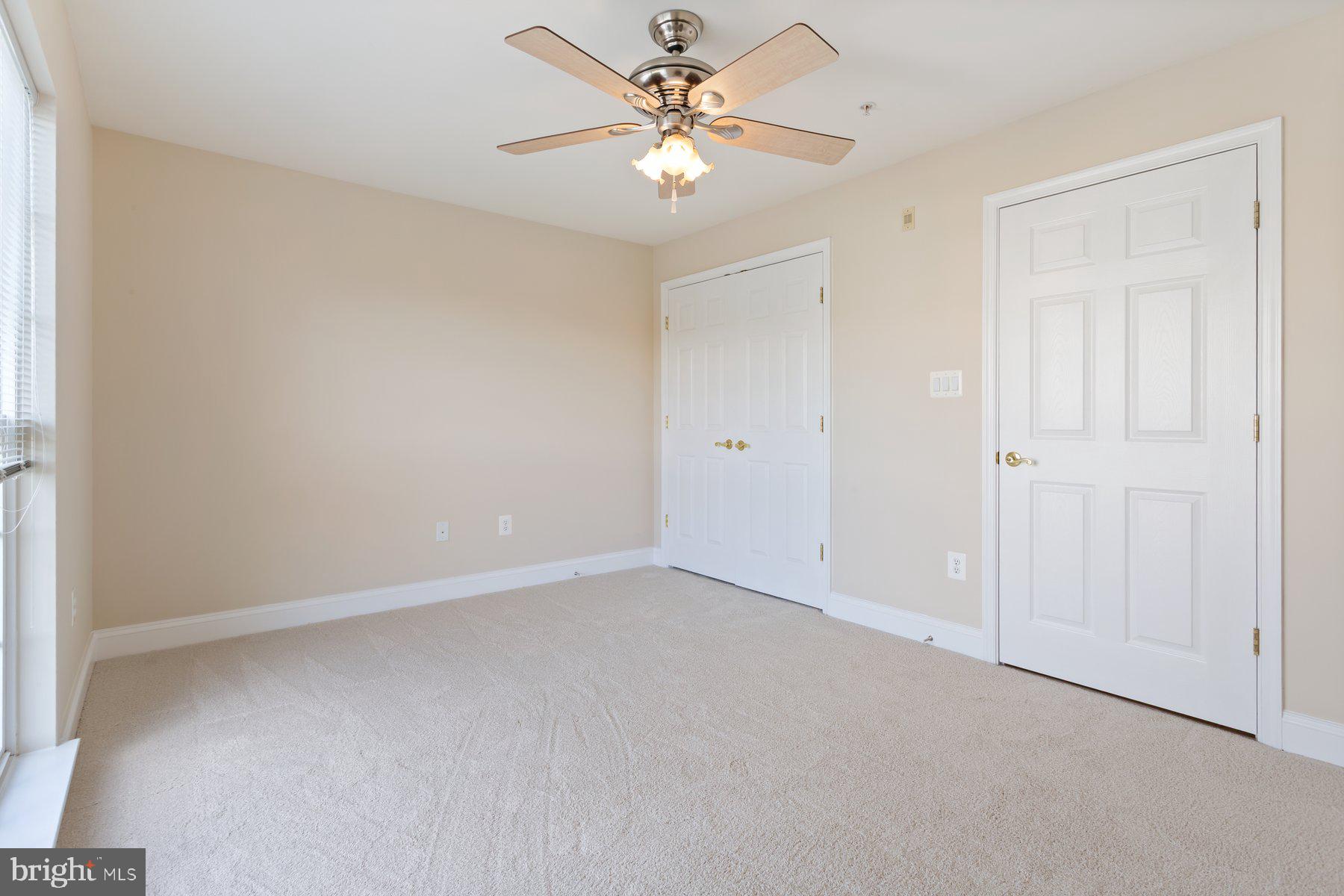 2500 Hemingway Drive, Unit 33D Frederick, MD 21702 - Photo 22 of 29 an empty room with closet and a ceiling fan