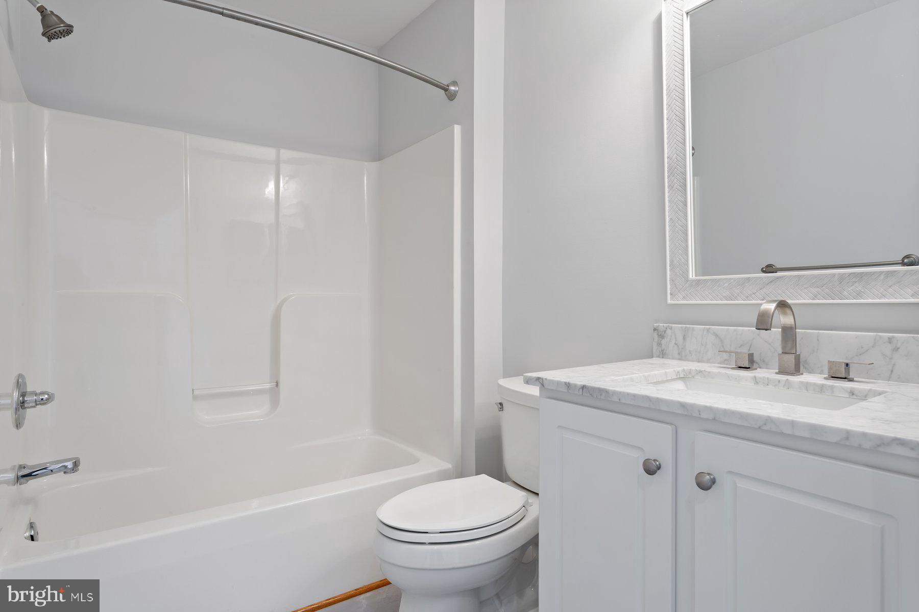 2500 Hemingway Drive, Unit 33D Frederick, MD 21702 - Photo 23 of 29 a bathroom with a sink toilet vanity and shower