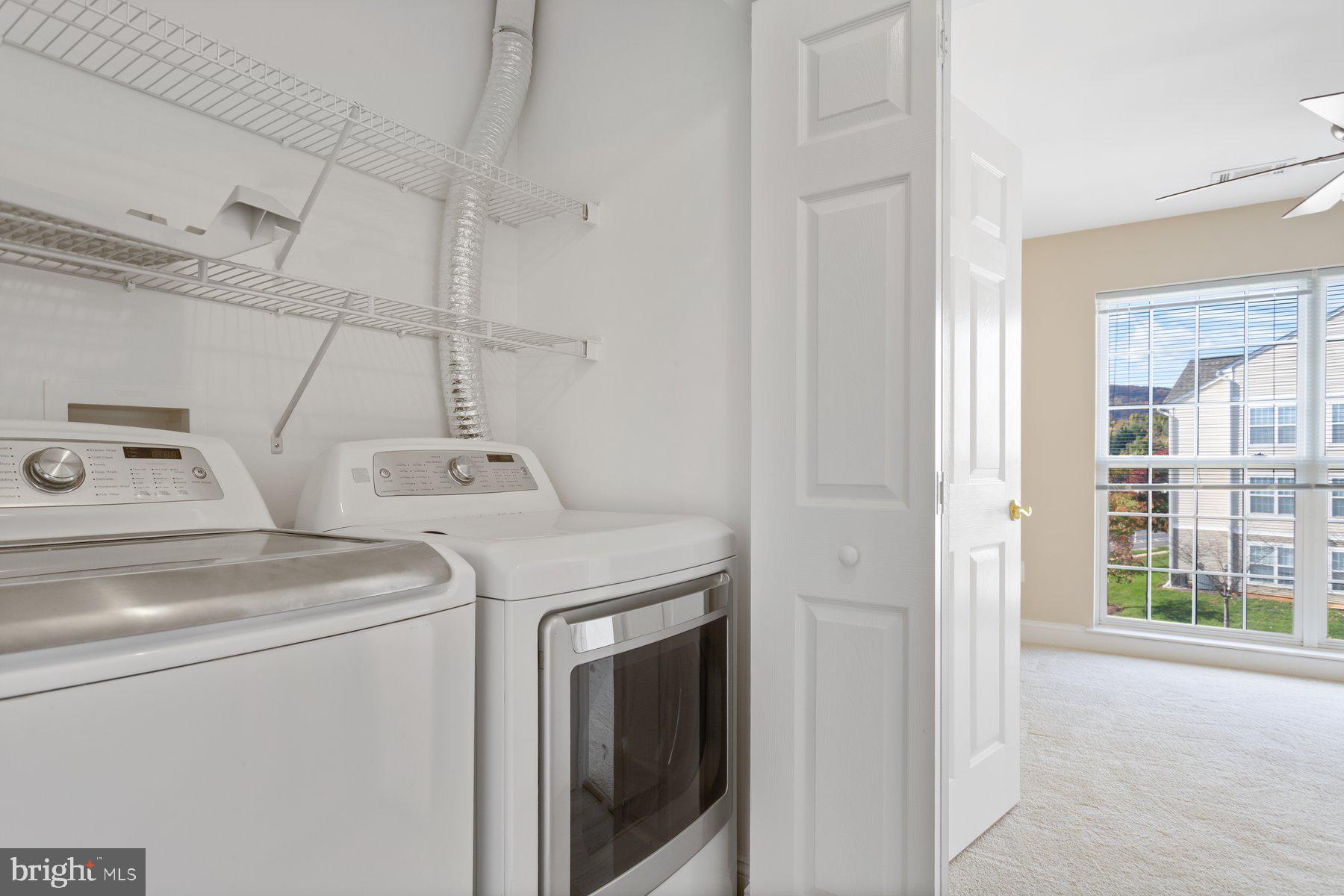 2500 Hemingway Drive, Unit 33D Frederick, MD 21702 - Photo 28 of 29 a utility room with dryer and washer