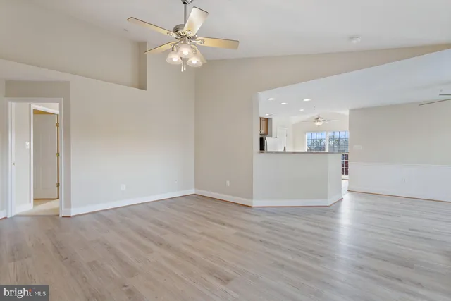 a view of a kitchen with a dishwasher cabinets and wooden floor