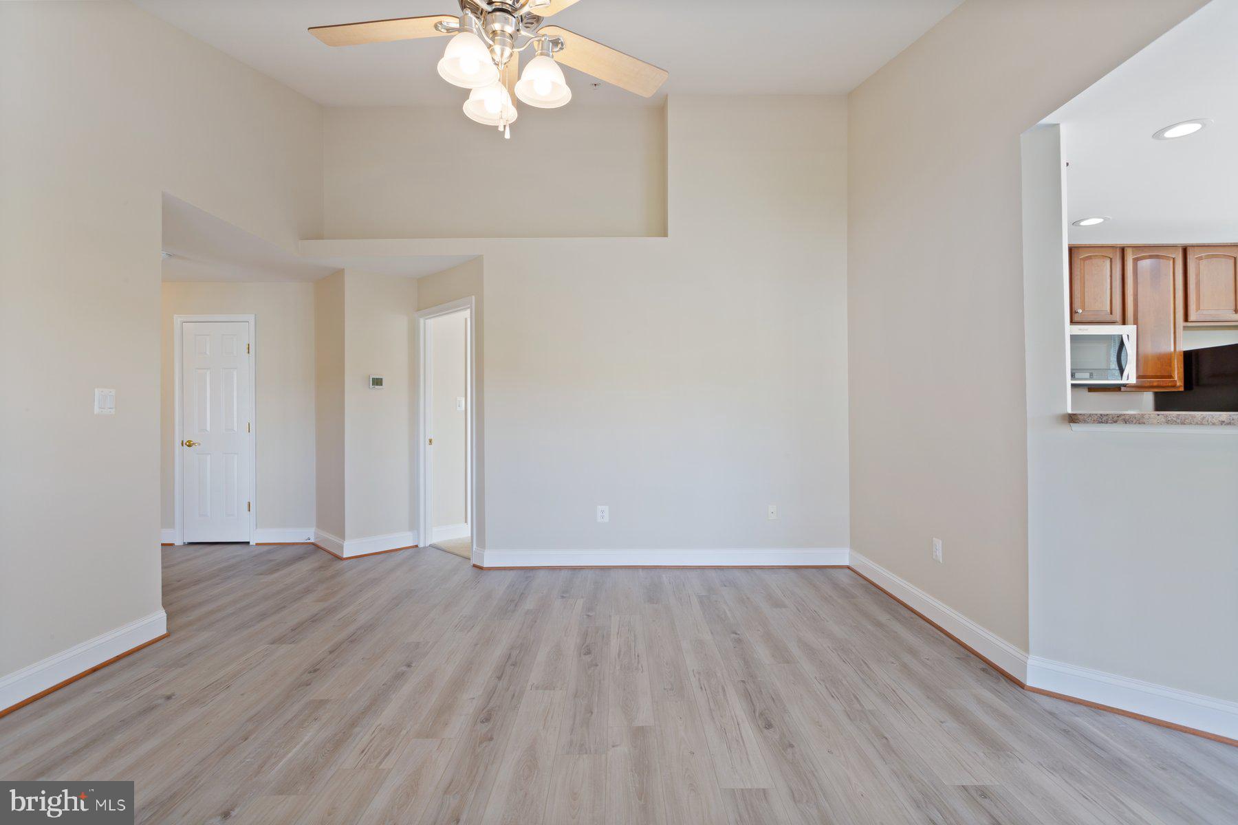 2500 Hemingway Drive, Unit 33D Frederick, MD 21702 - Photo 9 of 29 wooden floor in an empty room with a window