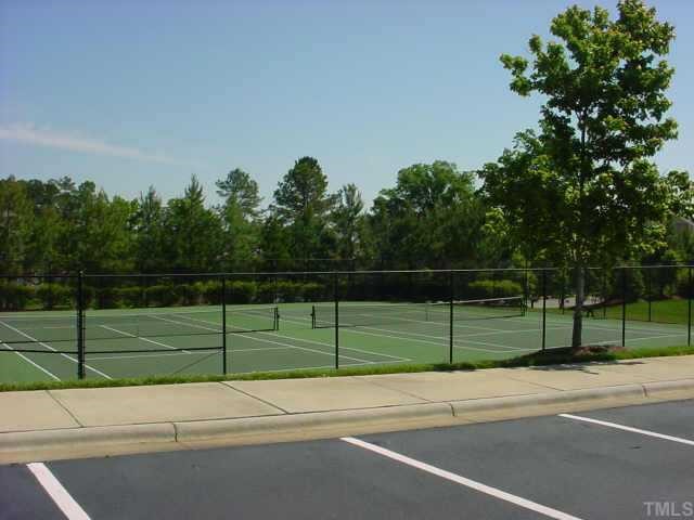 745 Seastone Street Raleigh, NC 27603 - Photo 4 of 10 Tennis courts located in between tot lot and pool.