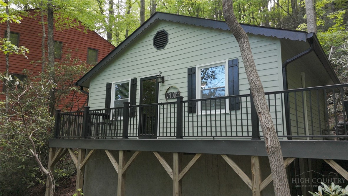 141 Snowflake Road Banner Elk, NC 28604 - Photo 2 of 28 a front view of a house with balcony