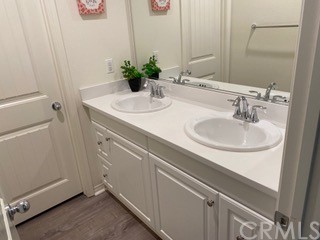 46326 Cask Lane Temecula, CA 92592 - Photo 21 of 22 a bathroom with a sink and a mirror