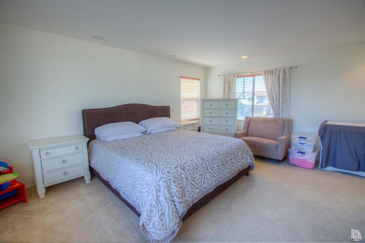 546 Morado Place Oxnard, CA 93030 - Photo 30 of 41 a bedroom with a bed and a window