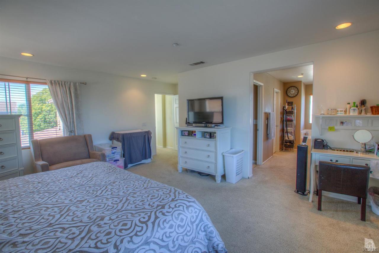 546 Morado Place Oxnard, CA 93030 - Photo 31 of 41 a bedroom with a bed and furniture
