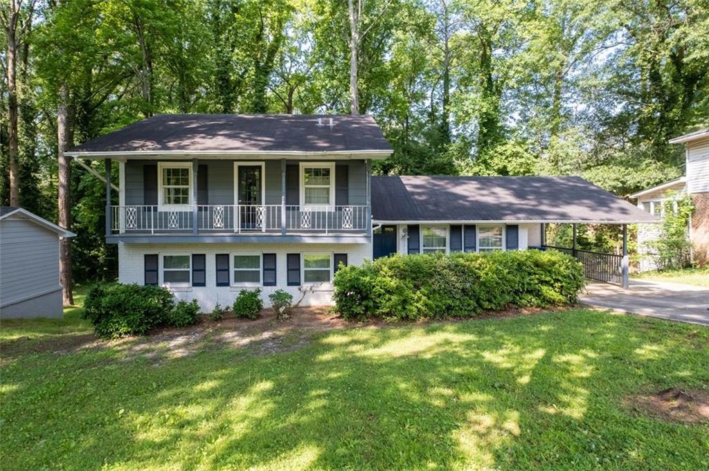 3911 Wedgefield Circle Decatur, GA 30035 - Photo 1 of 1 a front view of a house with a garden