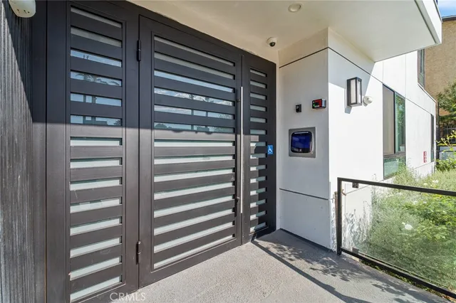 a view of kitchen with stainless steel appliances cabinets and a window
