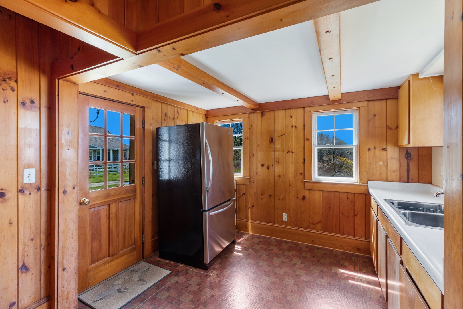 181 Polpis Road Nantucket, MA 02554 - Photo 19 of 22 a kitchen with stainless steel appliances granite countertop a refrigerator and a sink