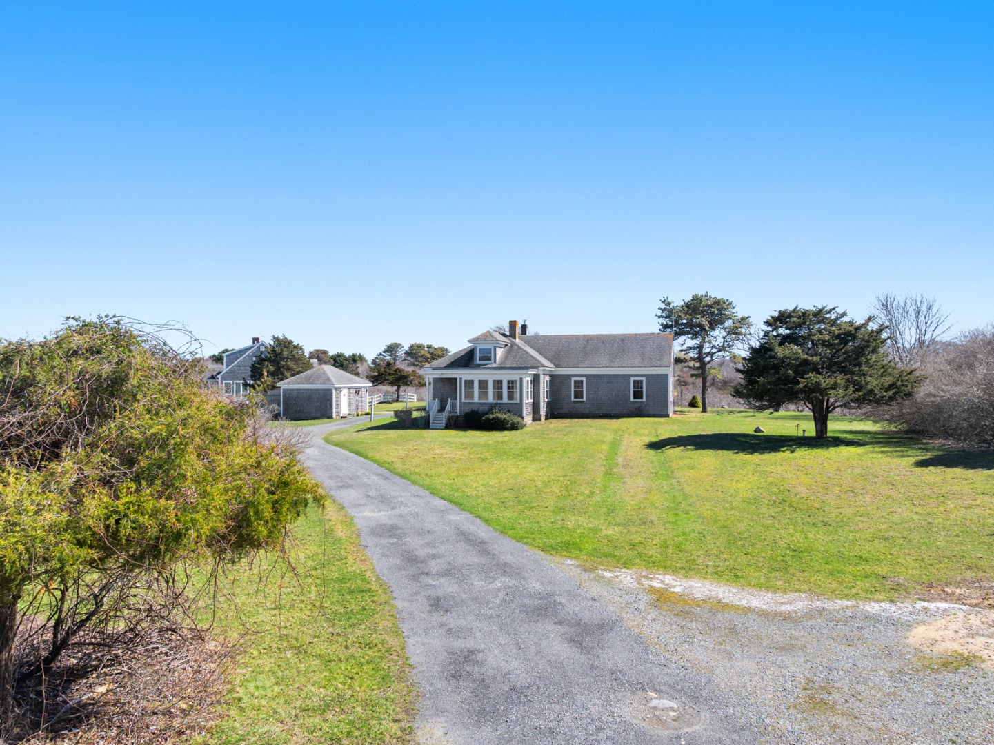 181 Polpis Road Nantucket, MA 02554 - Photo 8 of 22 a view of a swimming pool with an outdoor seating and a yard