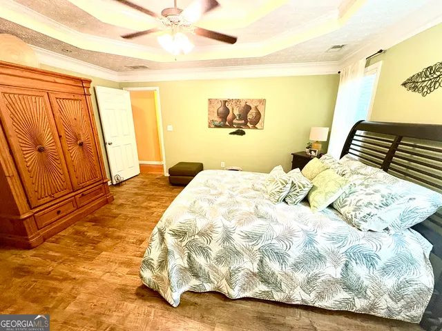 a bedroom with a bed and a couch