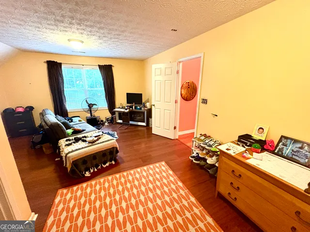 a bathroom with a sink a toilet and shower curtain