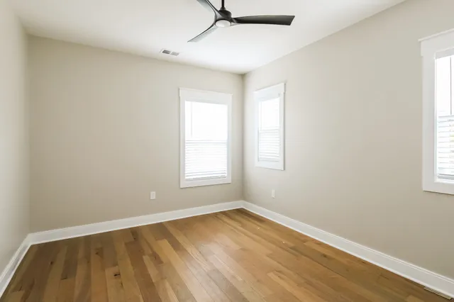a bathroom with a sink a toilet a mirror and vanity