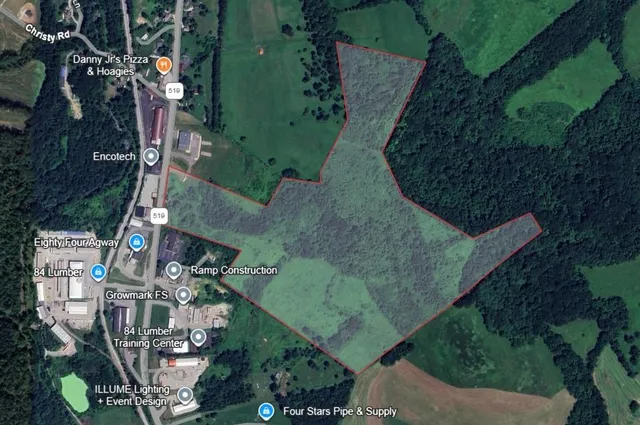 an aerial view of houses with outdoor space