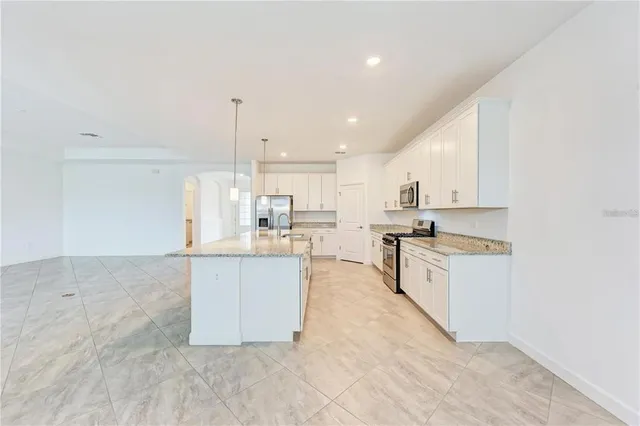 a kitchen with stainless steel appliances cabinets a sink and a counter top