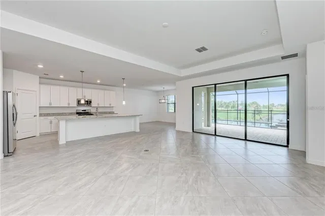 a view of kitchen with white cabinets