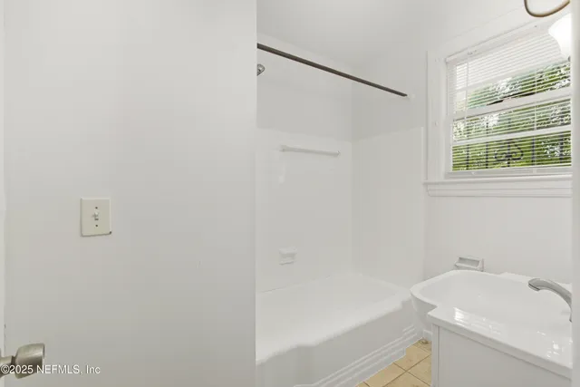a bathroom with a sink and a bathtub