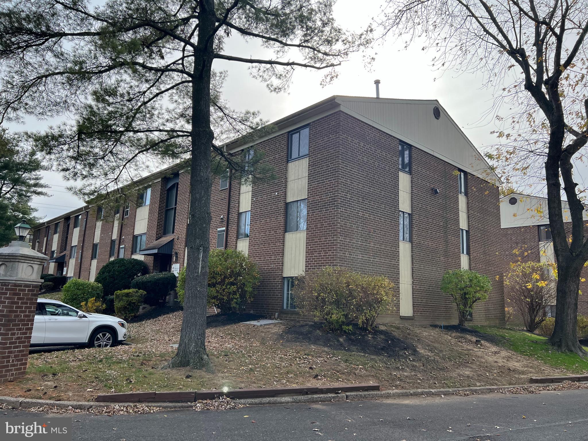 9921 Bustleton Avenue, Unit Q9 Philadelphia, PA 19115 - Photo 2 of 19 a view of a house with a yard