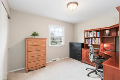 a view of workspace with furniture and window