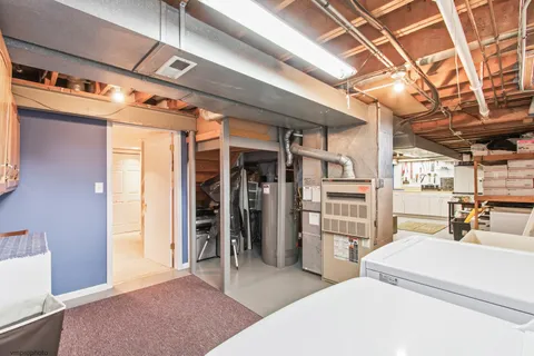 a bedroom with a bed and a mirror