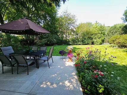 a view of yard with seating area and green space
