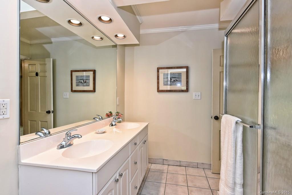 3118 Ferncliff Road Charlotte, NC 28211 - Photo 18 of 24 a bathroom with a double vanity sink mirror and shower