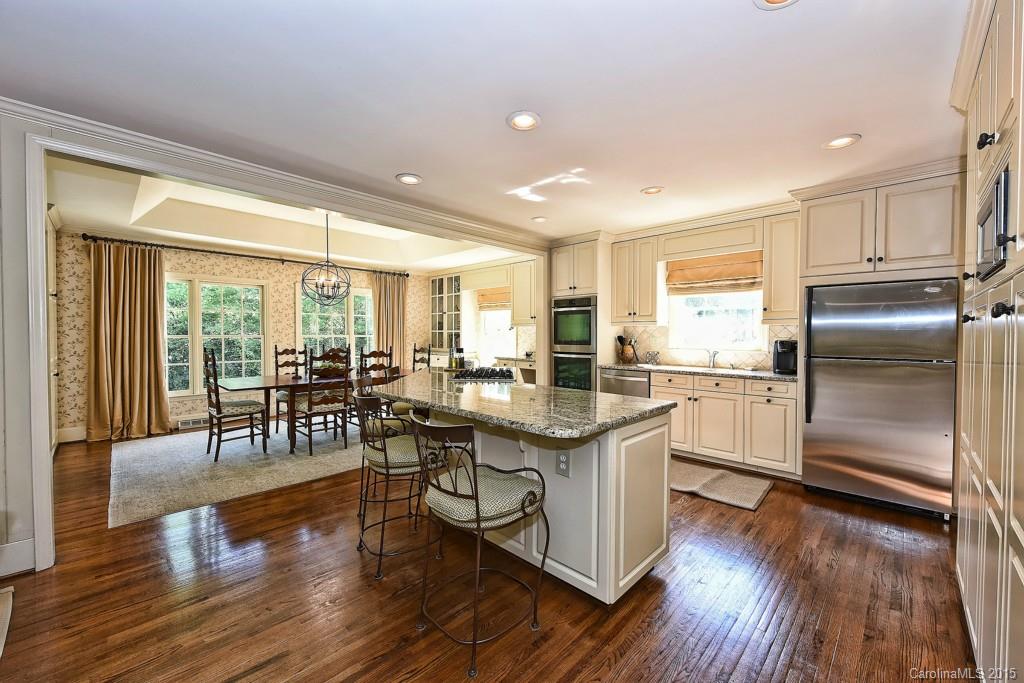 3118 Ferncliff Road Charlotte, NC 28211 - Photo 4 of 24 a kitchen with counter top space and wooden floor