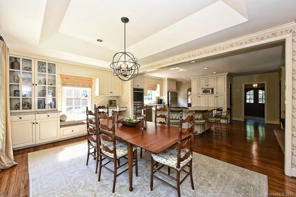 3118 Ferncliff Road Charlotte, NC 28211 - Photo 6 of 24 a view of a dining room and livingroom with furniture wooden floor a chandelier