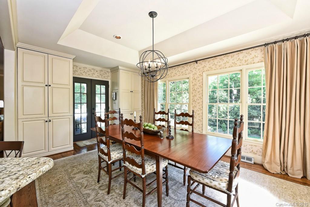 3118 Ferncliff Road Charlotte, NC 28211 - Photo 7 of 24 a dining room with furniture a chandelier and wooden floor