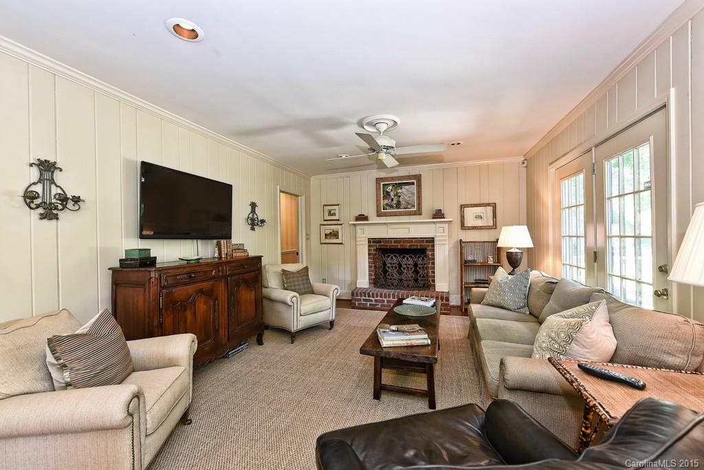 3118 Ferncliff Road Charlotte, NC 28211 - Photo 8 of 24 a living room with furniture a flat screen tv and a fireplace