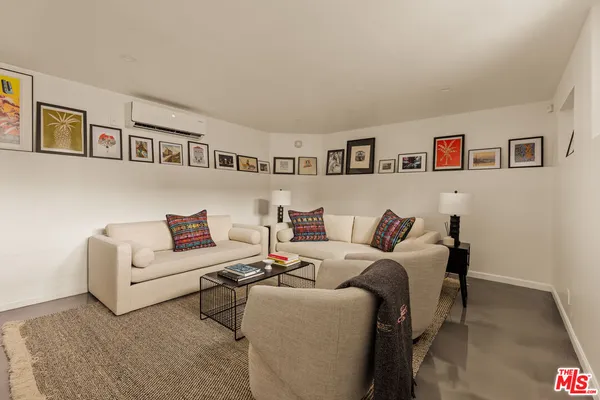 a living room with furniture and a table