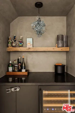 a kitchen with a cabinets and potted plant on the counter