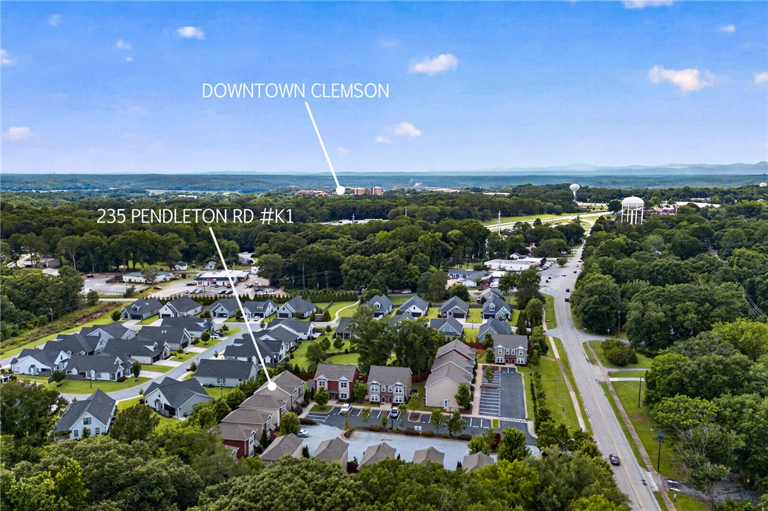 235 Pendleton Road, Unit K1 Clemson, SC 29631 - Photo 44 of 49 An aerial perspective reveals a vibrant neighborhood with verdant surroundings and a clear view of the city.