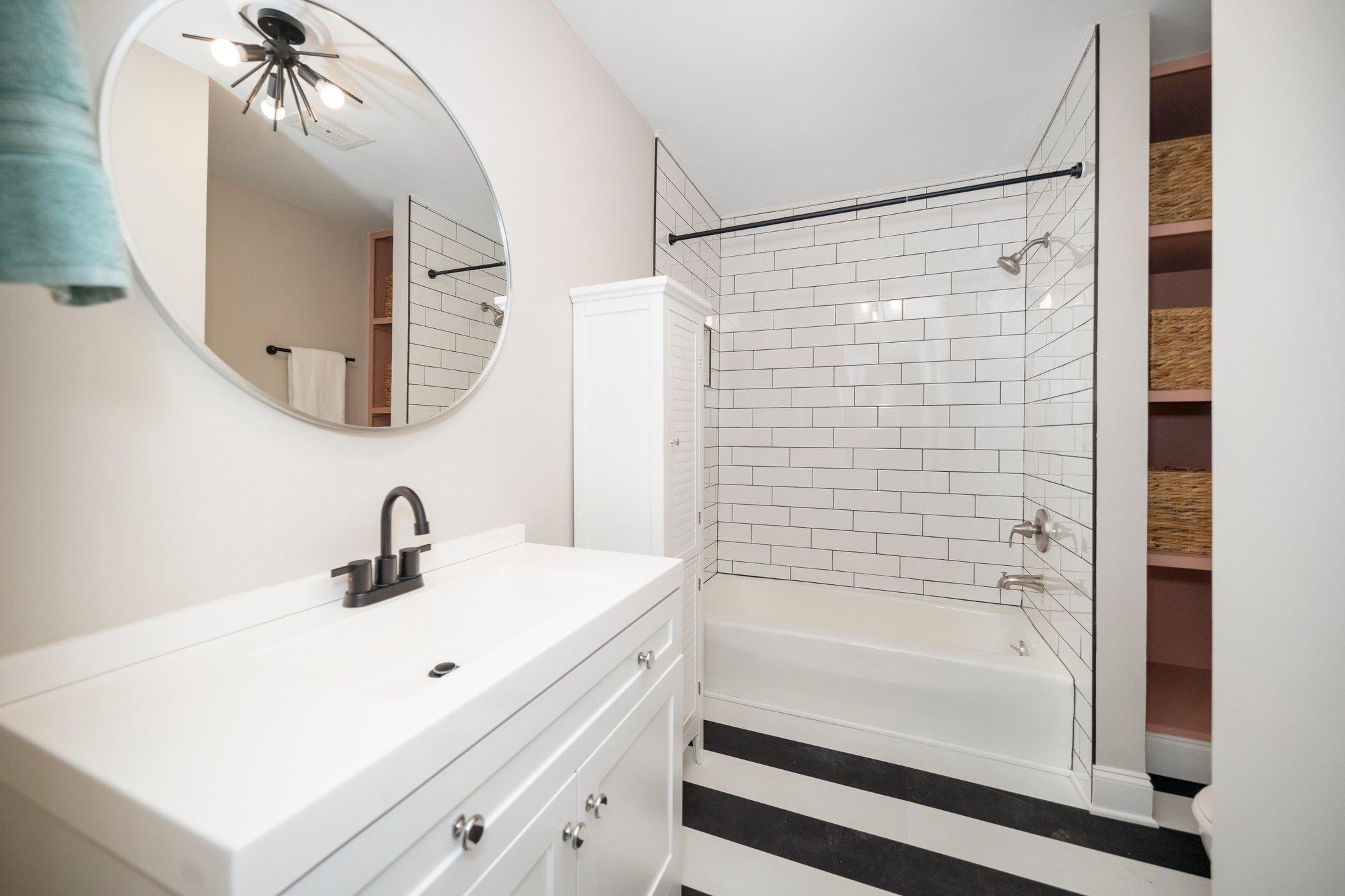 5504 Old Forge Circle Raleigh, NC 27609 - Photo 22 of 34 Nicely updated with tiled shower/tub surround and new vanity and flooring. Updated Guest Bathroom